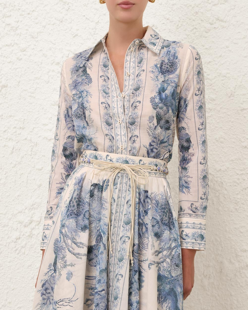 Woman wearing a floral dress with a white background