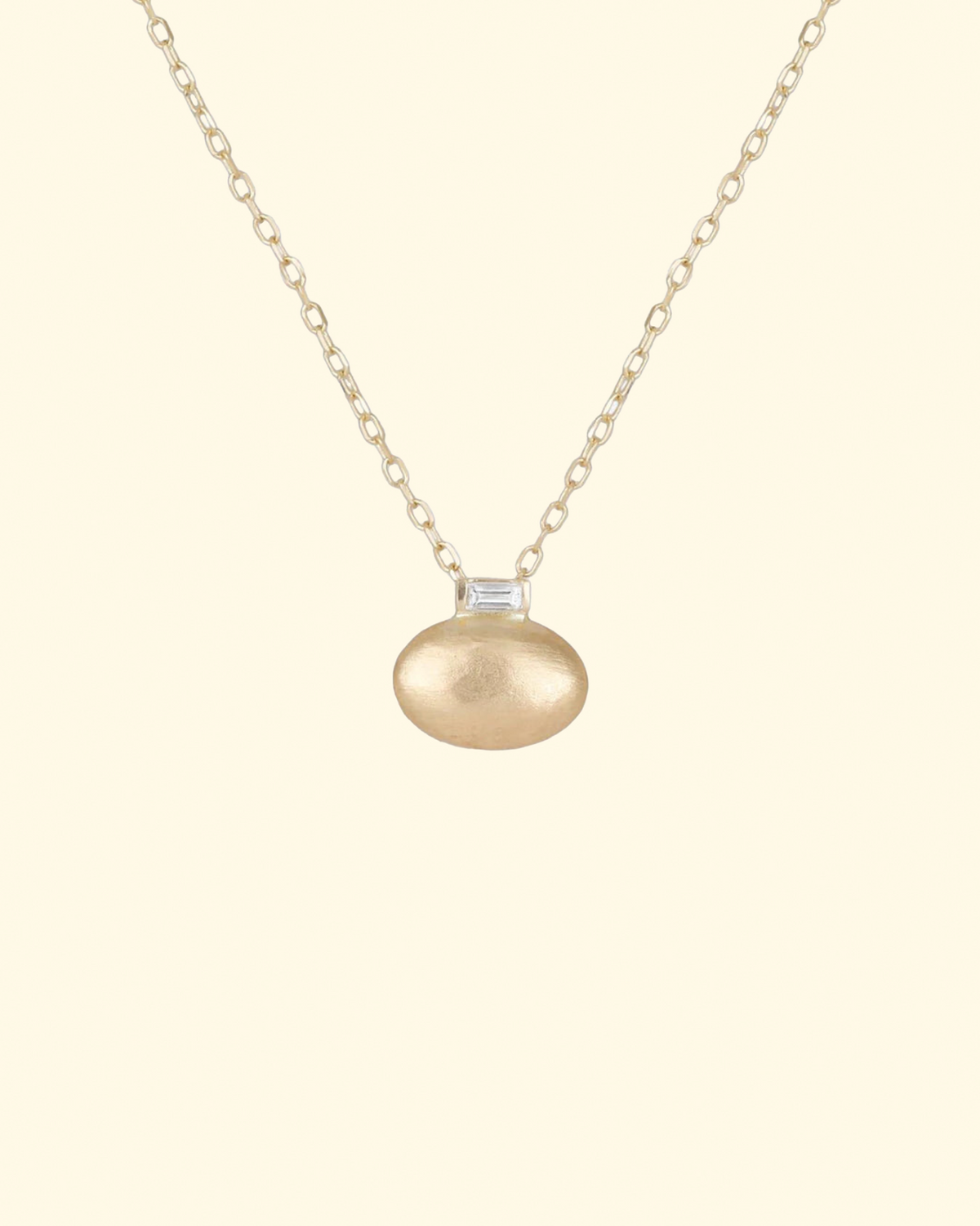 Small Oval Pendant with Baguette Diamond accent